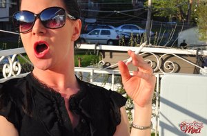 Smoking Mina offers a free xxx photo gallery with Mina unveiling nice form